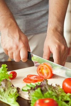 man cutting vegetables 