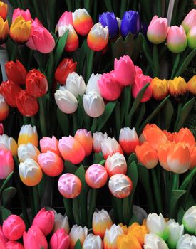 Image of colorful wooden tulips on a market stand in Amsterdam.