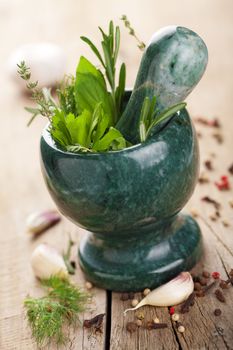 mortar with fresh herbs