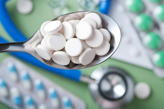 pills in spoon 