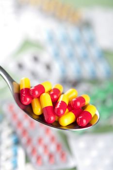 capsule pills in spoon