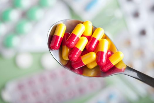 capsule pills in spoon