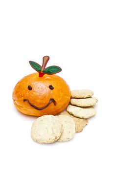 Orange smiley bread with biscuits on white background