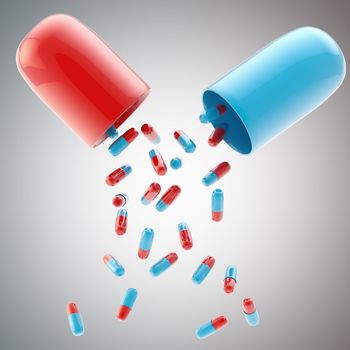 Medical pill falling from another huge glossy pill background