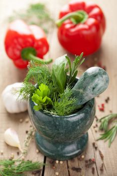 mortar with fresh herbs