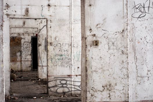 Abandoned building interior with white walls