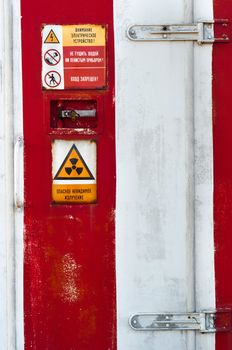 Closed Door of a nuclear facility with signs on it