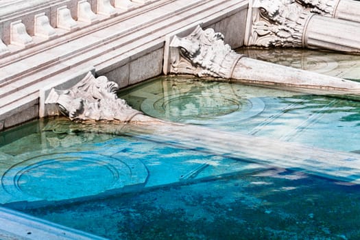 classic roman monument sunk in water