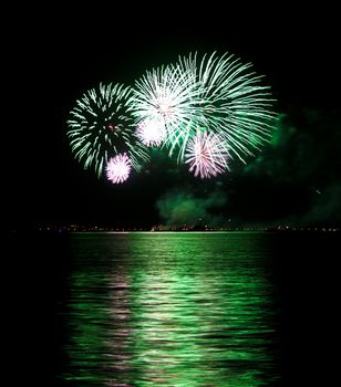 A fireworks in green displayed in the pyromusical competition at the bay