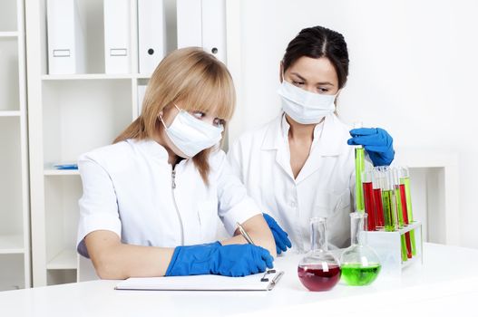 group of scientists working in laboratories with equipment