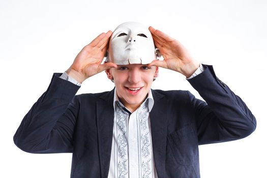 portrait of emotional actor in a mask. isolated on white background