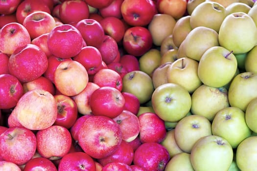 bunch of red and green apples closeup as a background