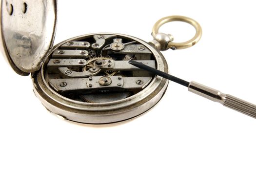 repair an old pocket watch on white background