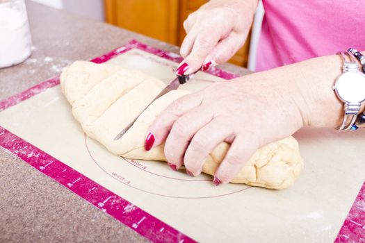 Cutting Turkish Pide pockets doughs.