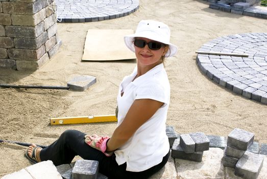 Lady with her sun glasses paving the bricks