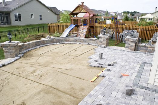 Paving patio on to levelled sand. Backyard Project.