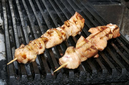 Chicken kebabs cooked on slow fire