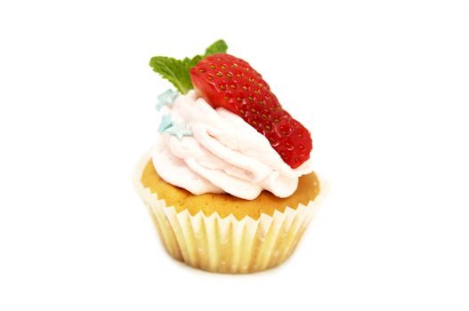 creamy dessert is decorated with a strawberry on a white background