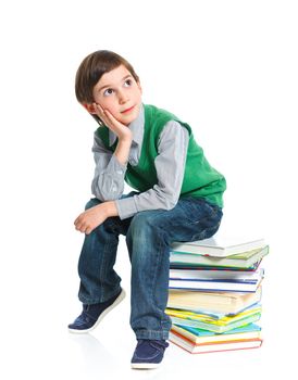 Education - funny boy with books. Isolated over white background.