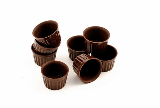 small Chocolate edible cups for pastry isolated on white background