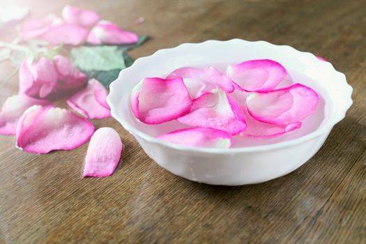 bowl with water and rose petals