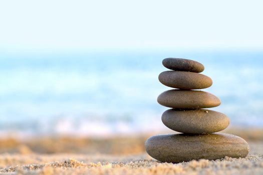 Rocks Stacked one on top of another on the background of the sea