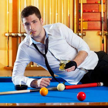 Billiard handsome player man drinking some alcohol in club