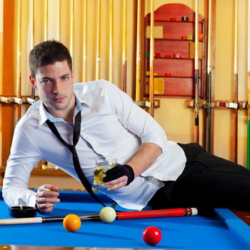 Billiard handsome player man drinking some alcohol in club