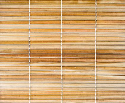 Bamboo sticks with thread uniting background