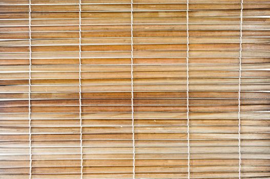 Bamboo sticks with thread uniting background