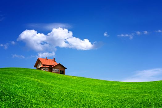 House on green field