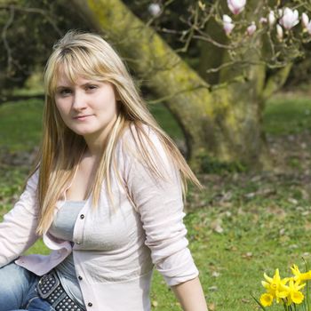 young woman in the park on a warm spring day