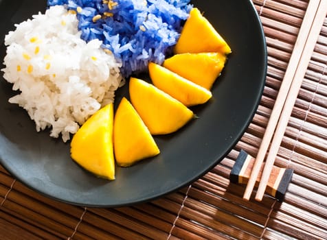 Thai style dessert, glutinous rice eat with mangoes