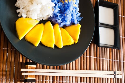 Thai style dessert, glutinous rice eat with mangoes