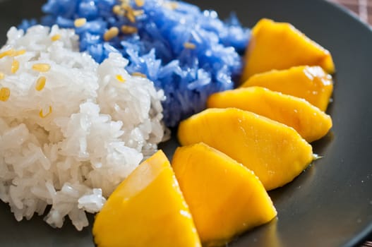 Thai style dessert, glutinous rice eat with mangoes
