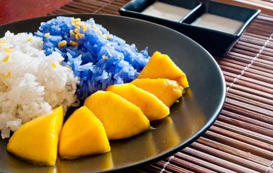 Thai style dessert, glutinous rice eat with mangoes