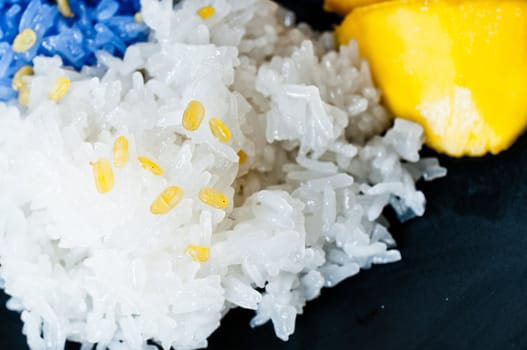 Thai style dessert, glutinous rice eat with mangoes