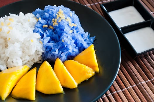 Thai style dessert, glutinous rice eat with mangoes