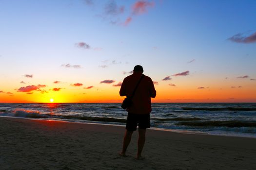 Photographer silhouette at sunset