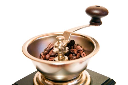 retro-styled coffee grinder from wood and steel on a white background
