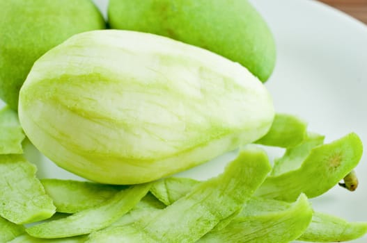 Mango fruit on white dish