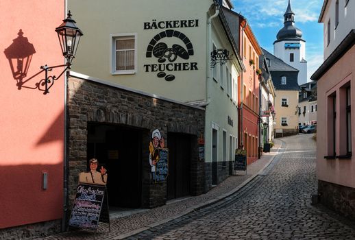 Narrow street with a typical baker's shop in Schwarzenberg-Erzgebirge, a small town at the slopes of Erzgebirge mountains.