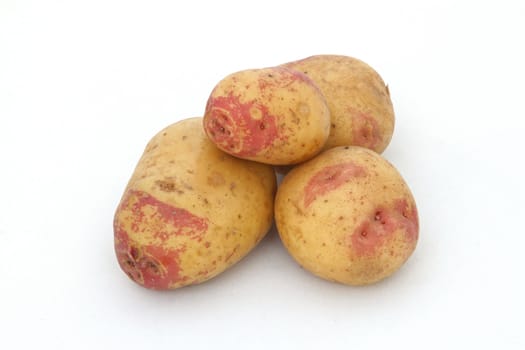 Organic potatoes on a white background.