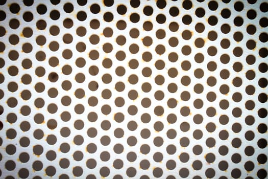 metal background with perforated holes