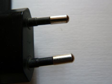 closeup of a two pin plug on white background