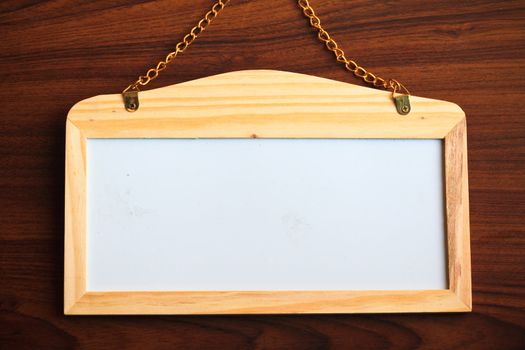 Whiteboard on wood background