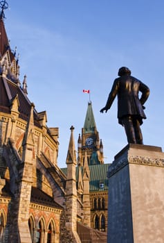 The Library, the Peace Tower and the statue of Thomas D'arcy McGee on Parliament Hill in Ottawa Canada.
