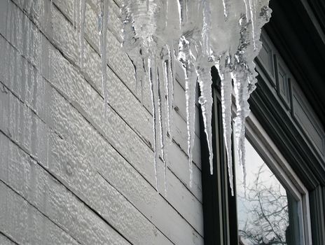 Icicles near the window in winter