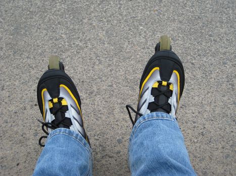 Roller skates on feet outdoors on a road