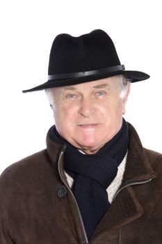 Elegant mature man in a black hat and scarf